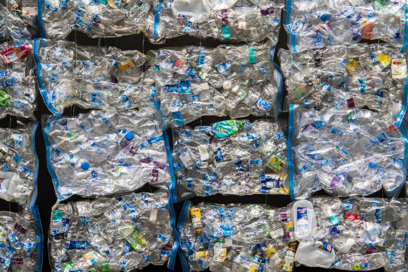 Sustainable Strategies | Multiple vacuum bagged plastic bottles placed next to each other.